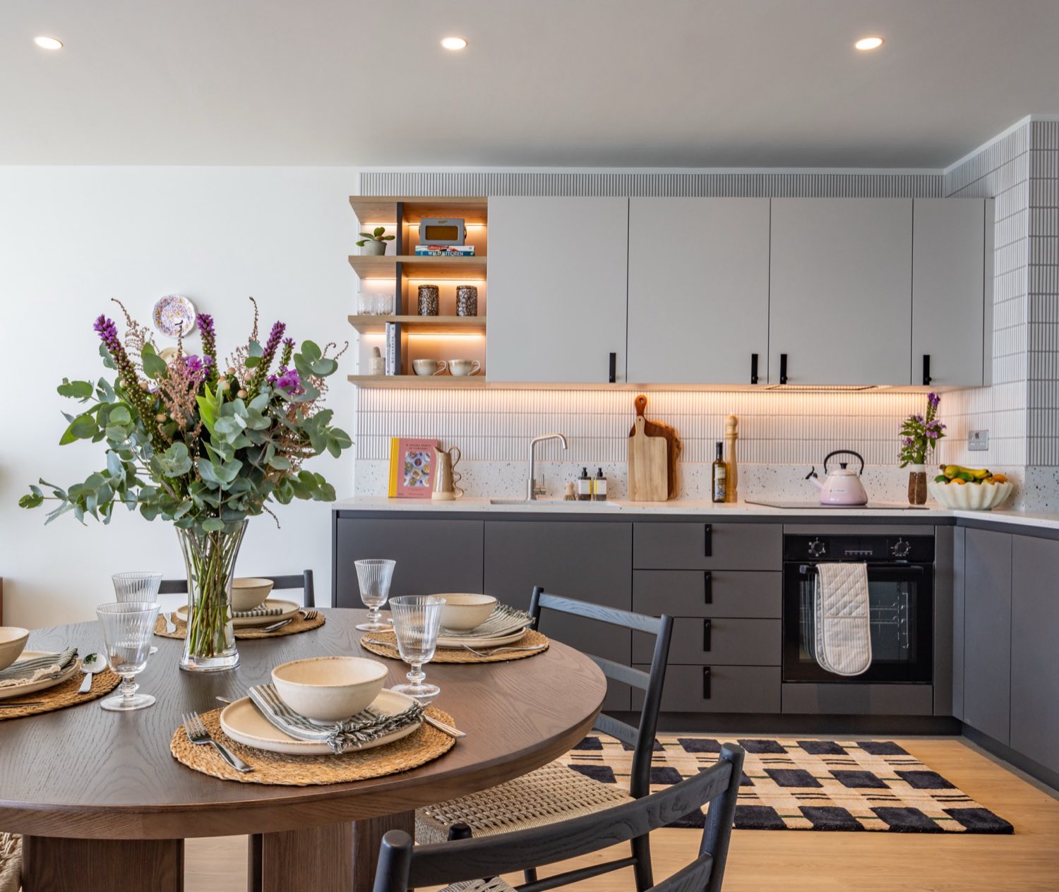 The kitchen and dining area of a three bedroom apartment at Ferry Island